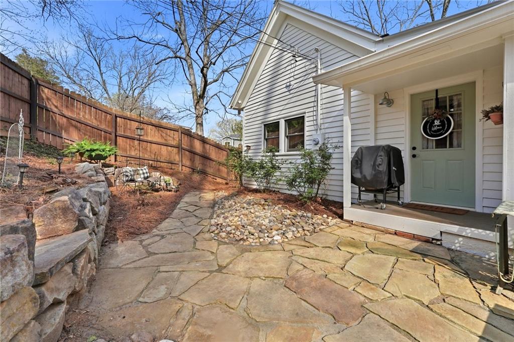 275 Strippling Street Ball Ground, GA 30107 - Photo 24 of 40 a backyard of a house with table and chairs