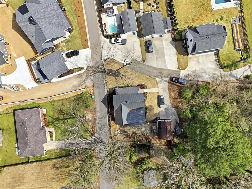 275 Strippling Street Ball Ground, GA 30107 - Photo 26 of 40 an aerial view of residential houses with outdoor space