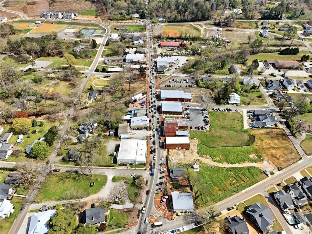275 Strippling Street Ball Ground, GA 30107 - Photo 29 of 40 an aerial view of residential houses with outdoor space