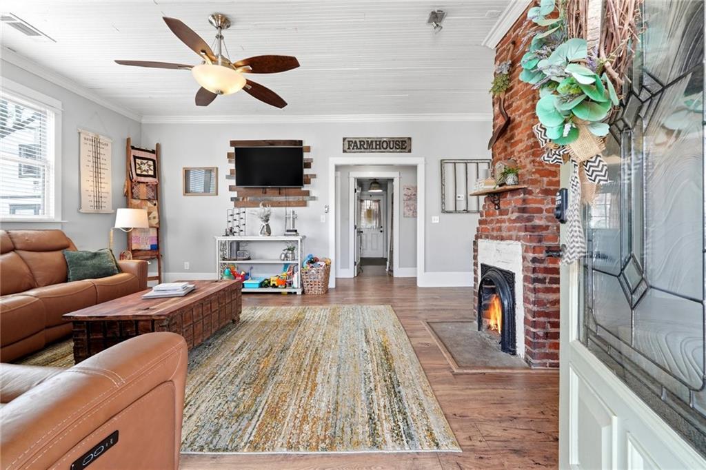275 Strippling Street Ball Ground, GA 30107 - Photo 6 of 40 a living room with fireplace furniture and a flat screen tv