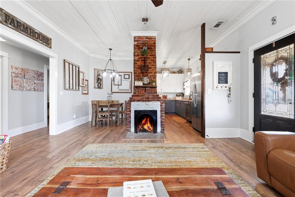 275 Strippling Street Ball Ground, GA 30107 - Photo 7 of 40 a living room with furniture and a fireplace