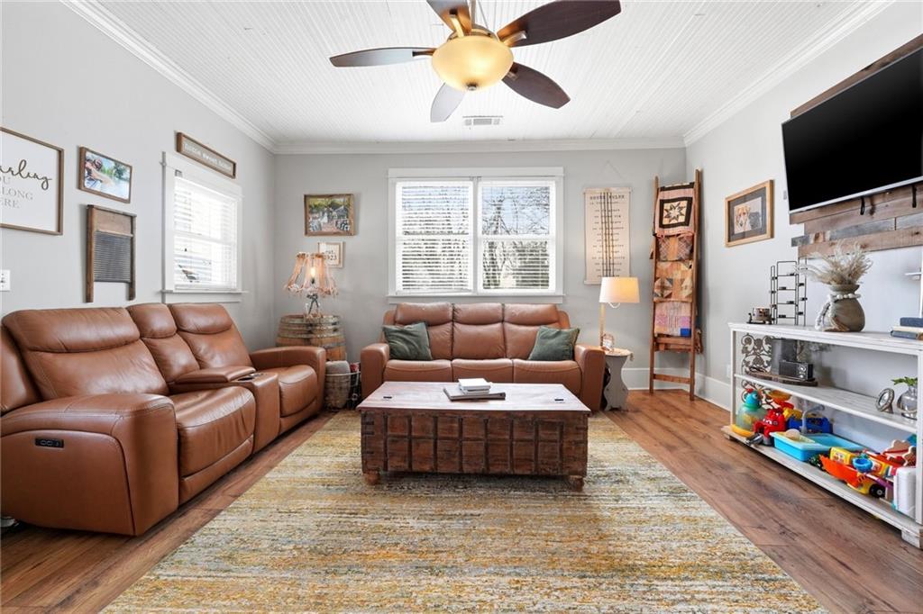 275 Strippling Street Ball Ground, GA 30107 - Photo 8 of 40 a living room with furniture and a flat screen tv