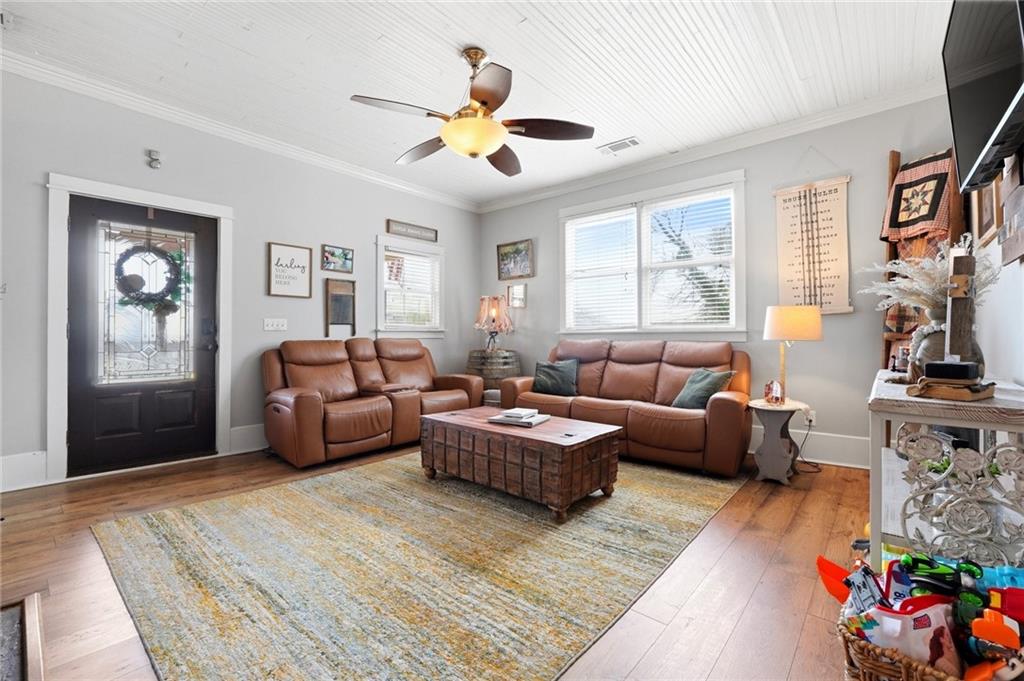 275 Strippling Street Ball Ground, GA 30107 - Photo 9 of 40 a living room with furniture fireplace and a window