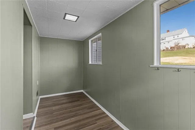a view of a room with wooden floor and walls