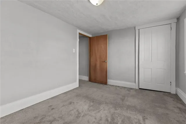 a view of an empty room and entryway