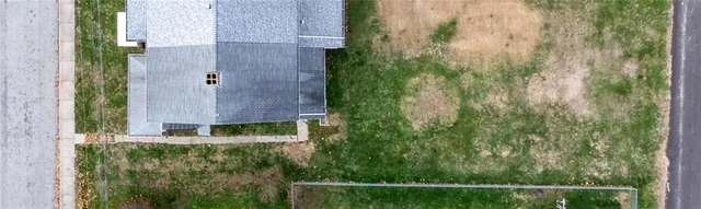 a balcony with next to a yard
