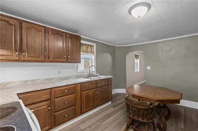 a room with a chair and cabinets