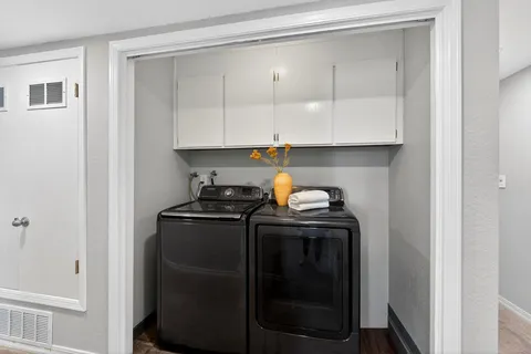 a view of storage and utility room with washer and dryer