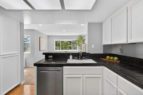a kitchen with a sink and a window