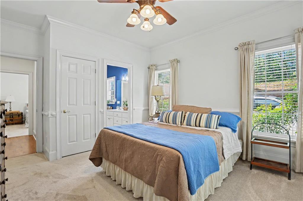 537 Old Collins Road Hoschton, GA 30548 - Photo 26 of 42 a bedroom with a bed and a window