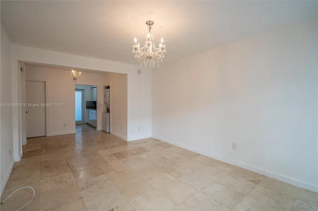 a view of a chandelier in an empty room