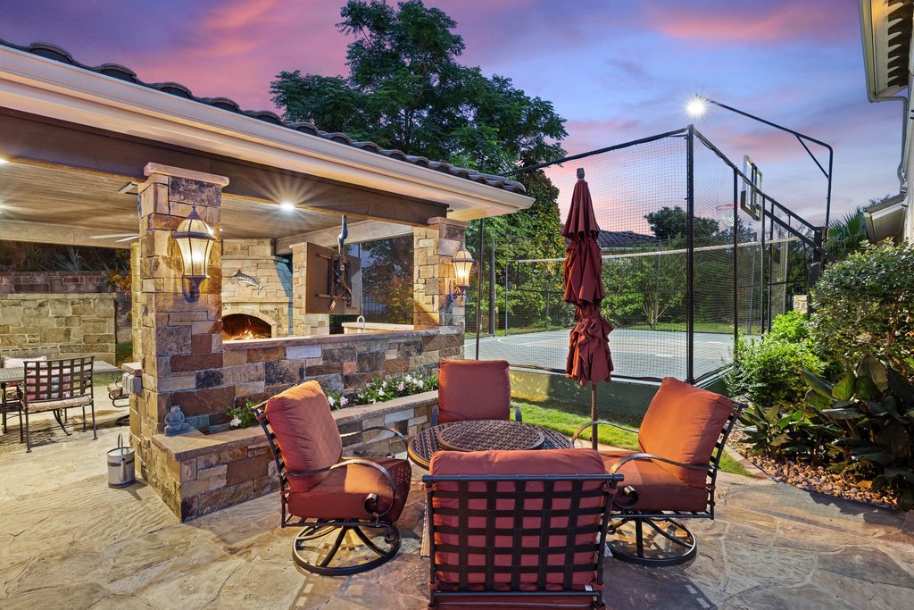 109 Largo Cove Austin, TX 78734 - Photo 34 of 40 An inviting outdoor kitchen and patio space with a nearby sport court offers endless entertainment possibilities.