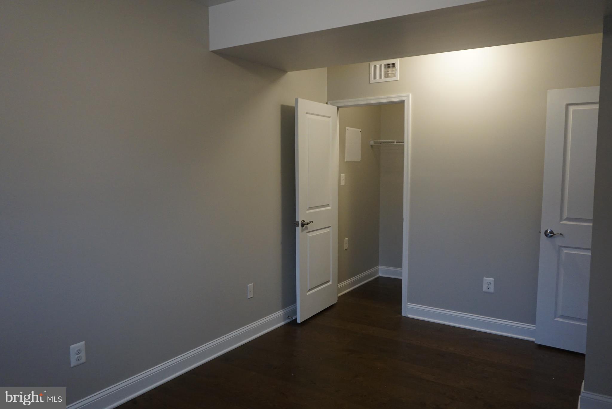 3611 Florida Road Baltimore, MD 21244 - Photo 16 of 30 an empty room with wooden floor and closet