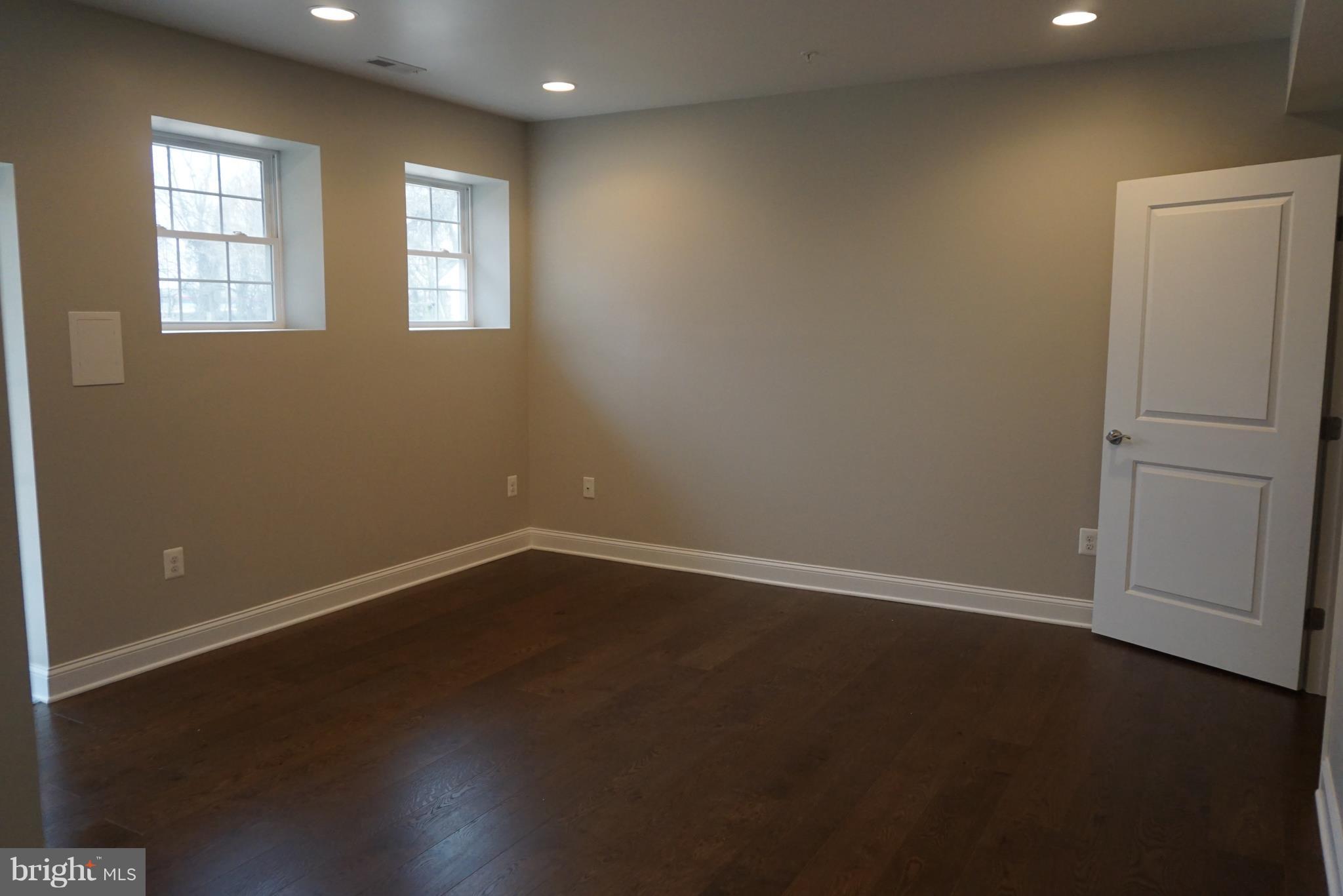 3611 Florida Road Baltimore, MD 21244 - Photo 18 of 30 an empty room with wooden floor and windows