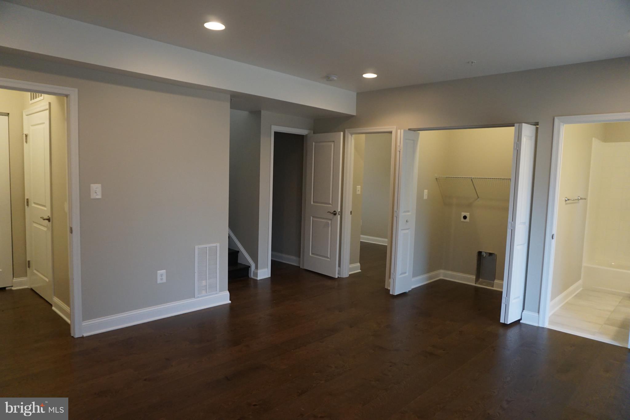 3611 Florida Road Baltimore, MD 21244 - Photo 26 of 30 an empty room with closet and wooden floor