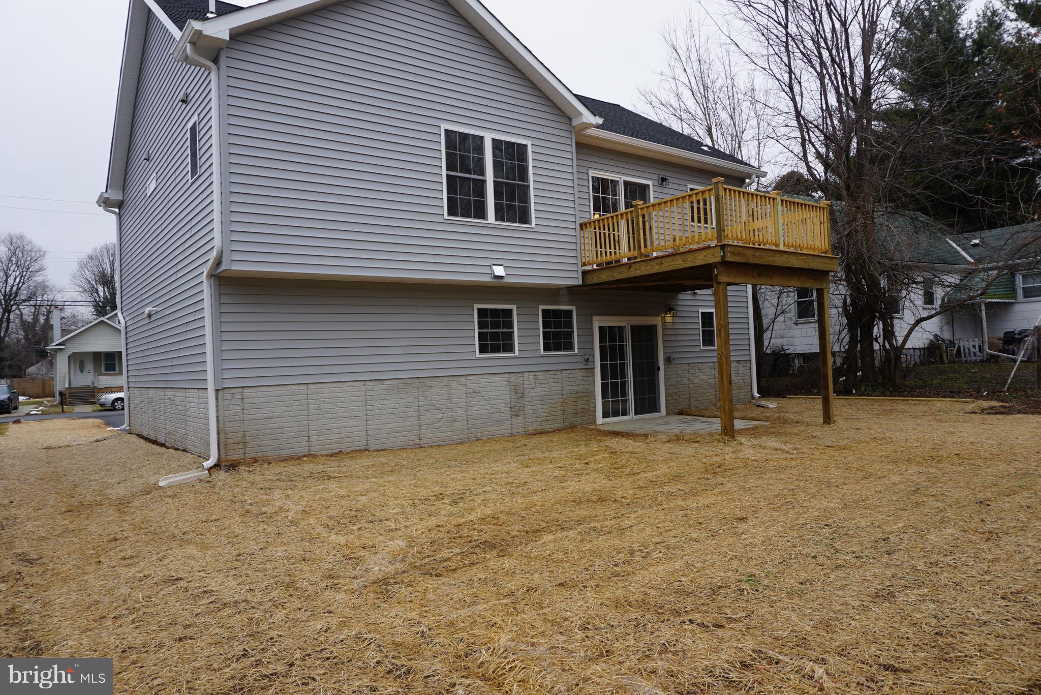 3611 Florida Road Baltimore, MD 21244 - Photo 29 of 30 a view of a house with a backyard and trees