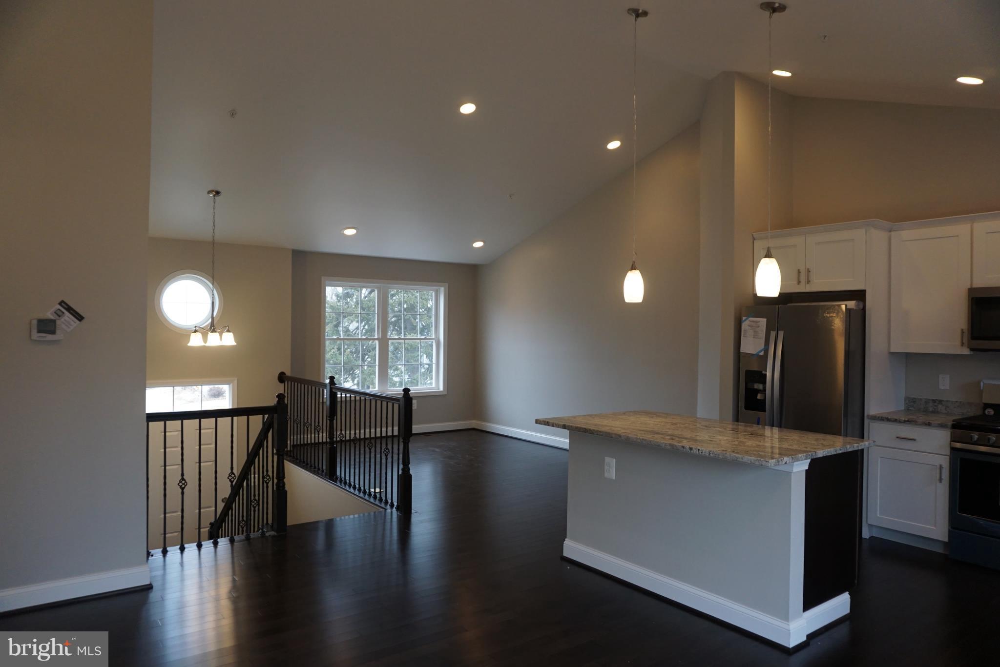 3611 Florida Road Baltimore, MD 21244 - Photo 6 of 30 a view of kitchen with refrigerator and wooden floor