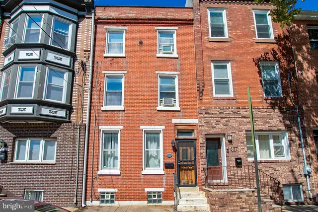 a front view of a multi story residential apartment building