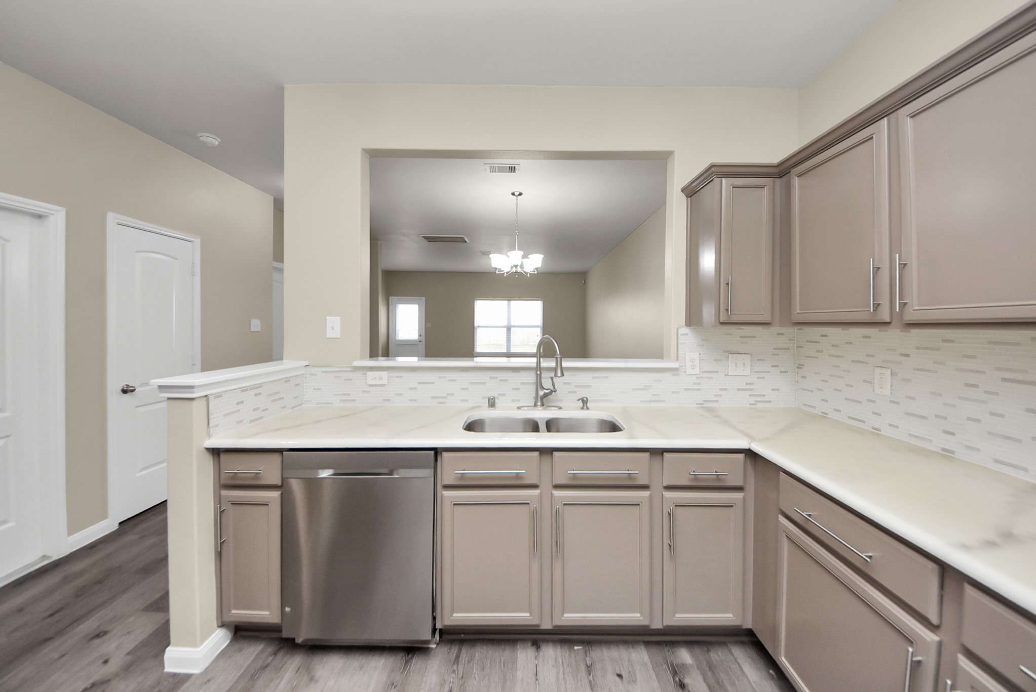 1855 Garnet Breeze Drive Rosharon, TX 77583 - Photo 11 of 38 a kitchen with a sink and cabinets