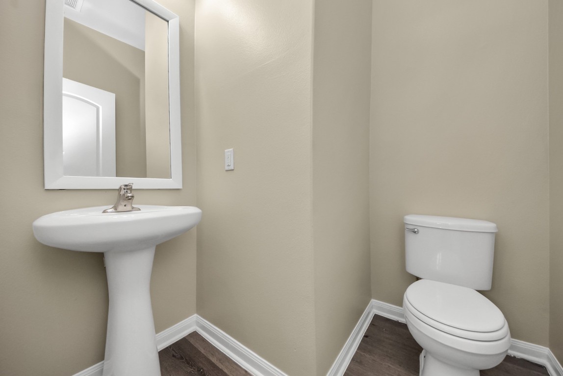 1855 Garnet Breeze Drive Rosharon, TX 77583 - Photo 12 of 38 a bathroom with a sink toilet and a mirror