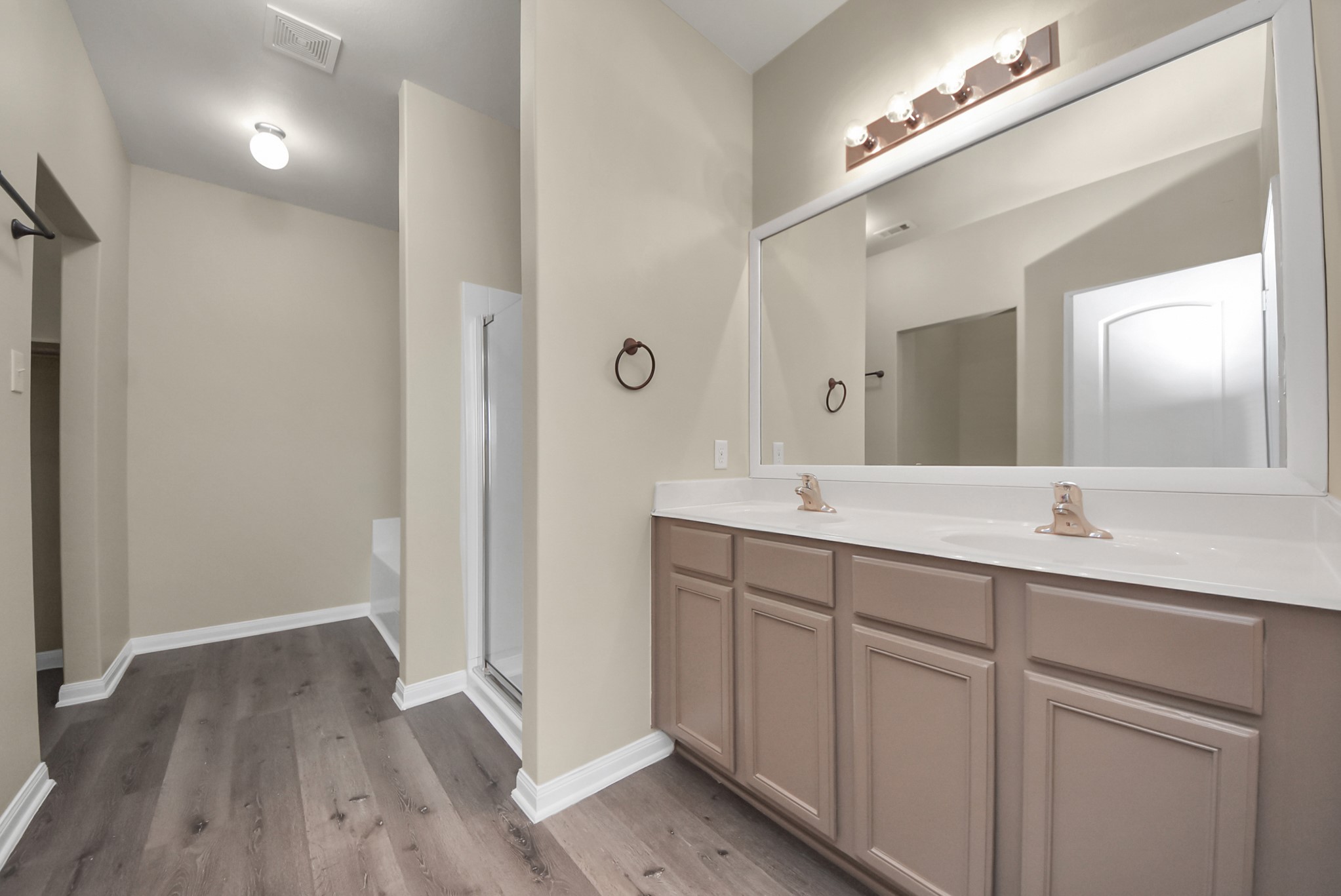 1855 Garnet Breeze Drive Rosharon, TX 77583 - Photo 17 of 38 a bathroom with a double vanity sink and mirror