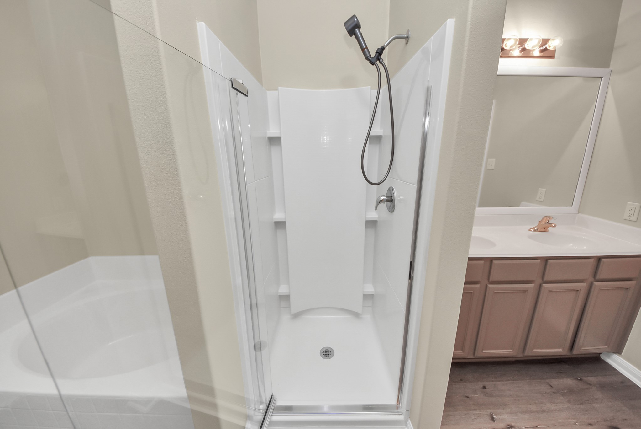 1855 Garnet Breeze Drive Rosharon, TX 77583 - Photo 18 of 38 a bathroom with a shower and a sink