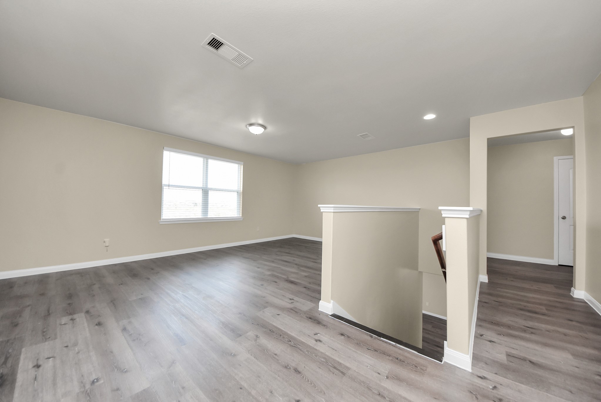 1855 Garnet Breeze Drive Rosharon, TX 77583 - Photo 21 of 38 a view of empty room with wooden floor and window
