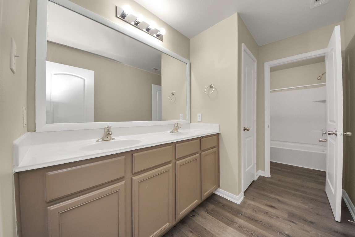 1855 Garnet Breeze Drive Rosharon, TX 77583 - Photo 24 of 38 a bathroom with a sink and a mirror