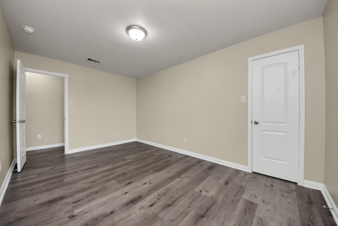 1855 Garnet Breeze Drive Rosharon, TX 77583 - Photo 32 of 38 a view of an empty room with wooden floor