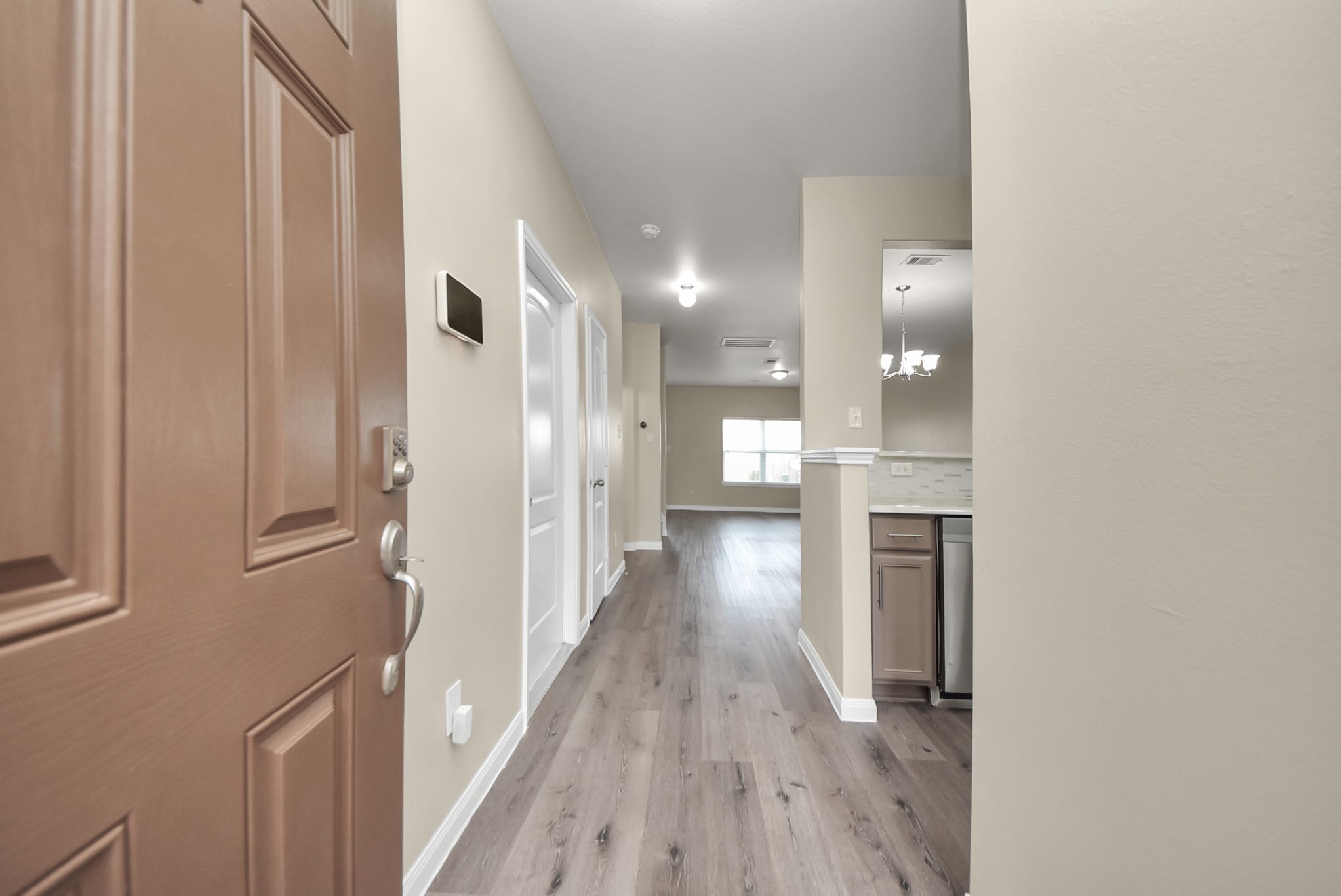 1855 Garnet Breeze Drive Rosharon, TX 77583 - Photo 6 of 38 a view of a hallway with wooden floor