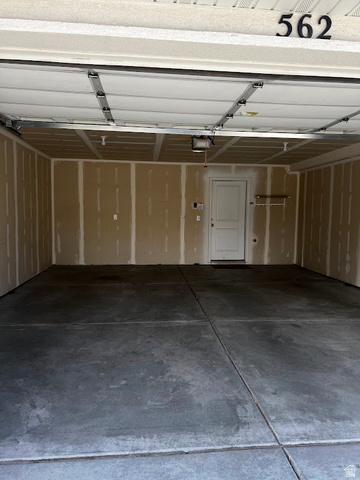 562 Hal Street, Unit 152 Tooele, UT 84074 - Photo 8 of 44 Spacious two-car garage with concrete flooring, automatic garage door opener, and interior access door