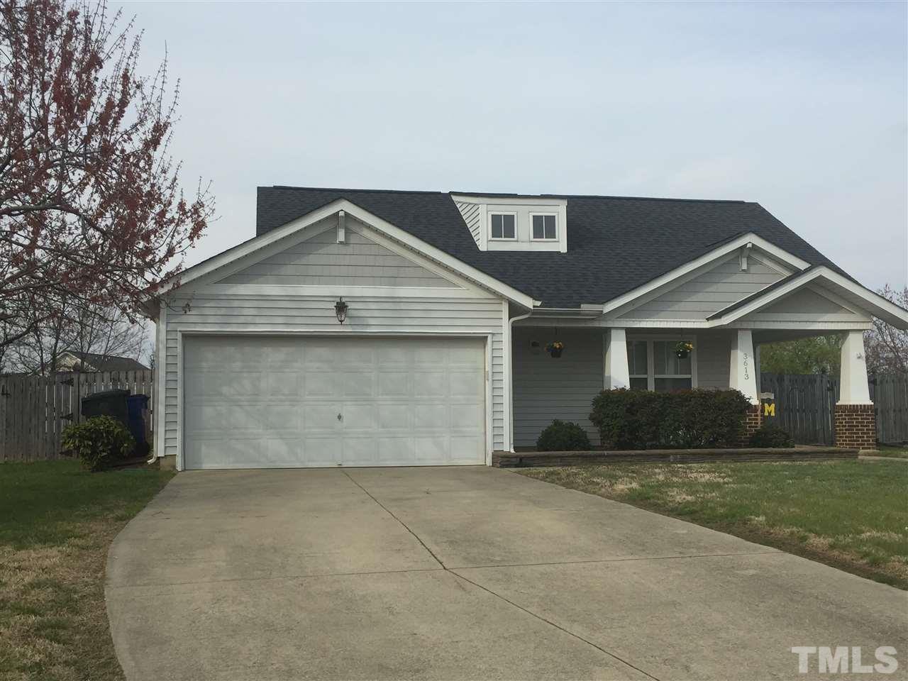 3613 Deering Drive Raleigh, NC 27616 - Photo 1 of 20 a front view of a house with a yard and garage