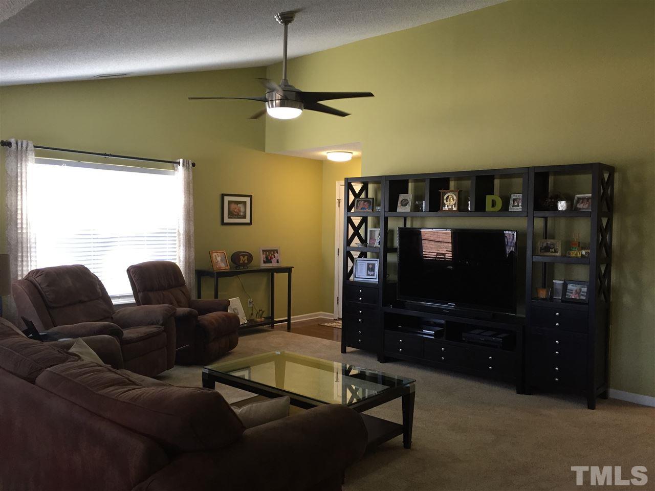 3613 Deering Drive Raleigh, NC 27616 - Photo 2 of 20 a living room with furniture and a flat screen tv