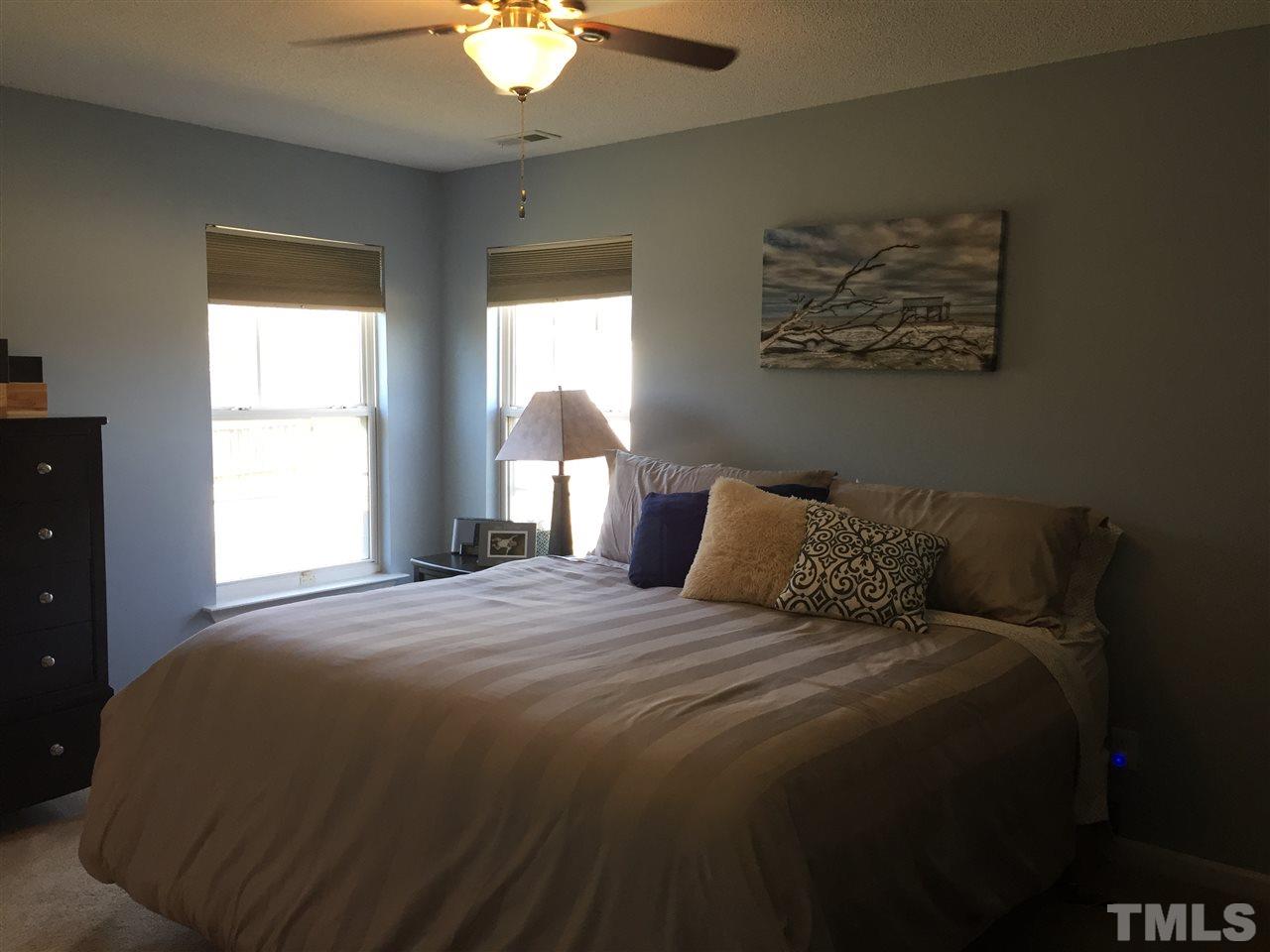 3613 Deering Drive Raleigh, NC 27616 - Photo 11 of 20 a bedroom with a bed and a window