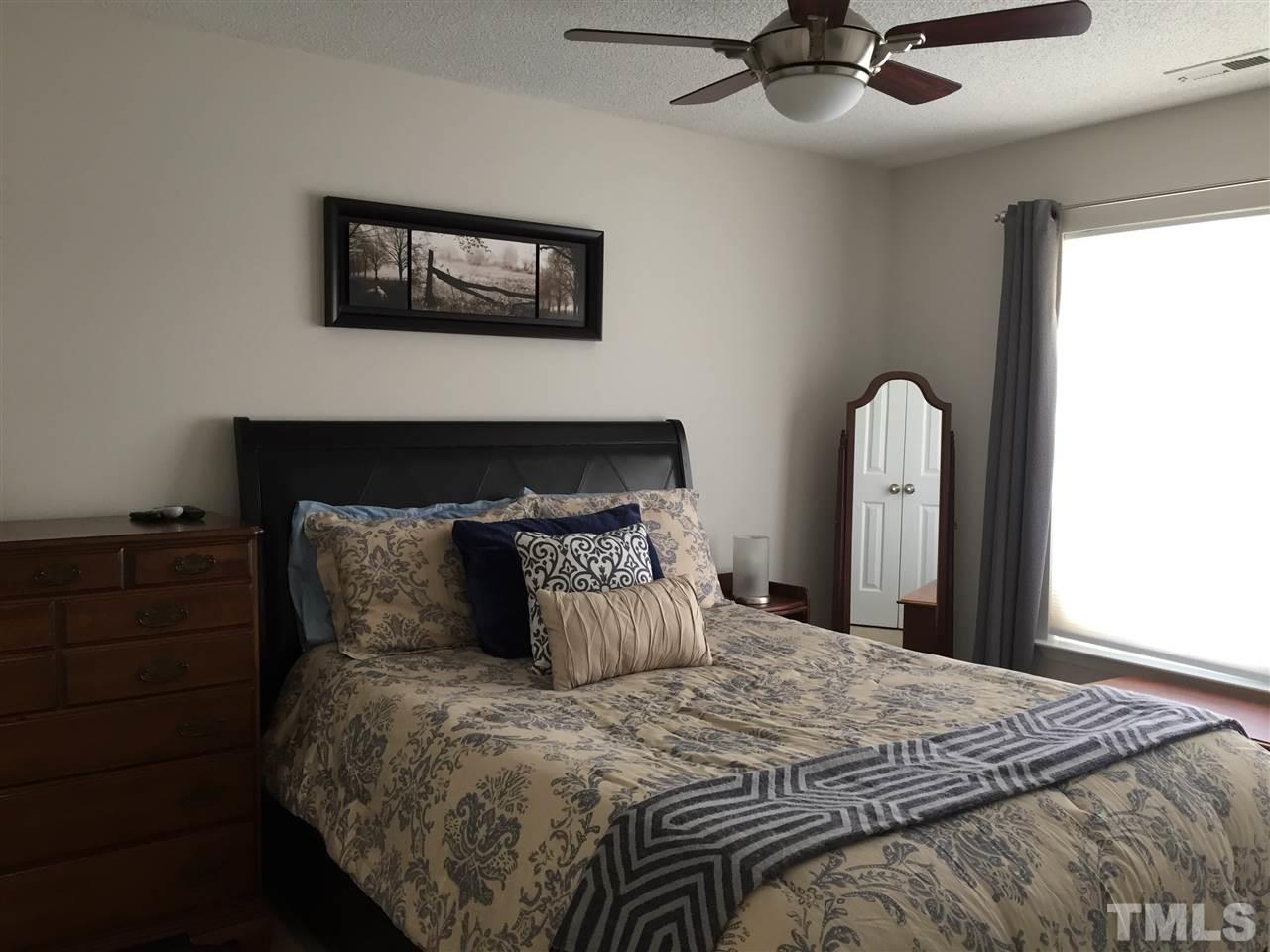 3613 Deering Drive Raleigh, NC 27616 - Photo 14 of 20 a bedroom with a bed and a painting on the wall