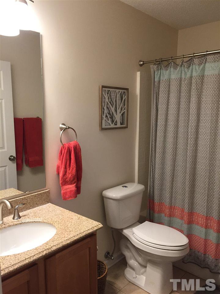 3613 Deering Drive Raleigh, NC 27616 - Photo 15 of 20 a bathroom with a toilet sink and shower