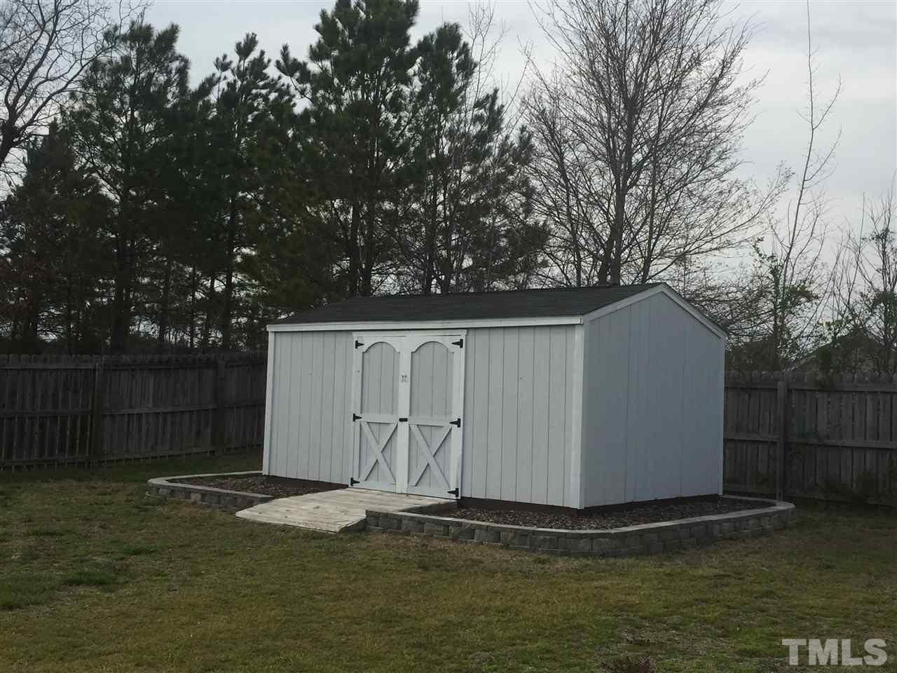 3613 Deering Drive Raleigh, NC 27616 - Photo 20 of 20 a white building with trees in front of it