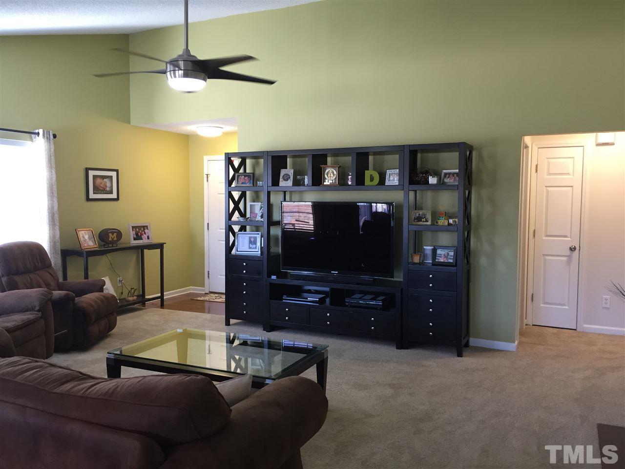 3613 Deering Drive Raleigh, NC 27616 - Photo 4 of 20 a living room with furniture and a flat screen tv