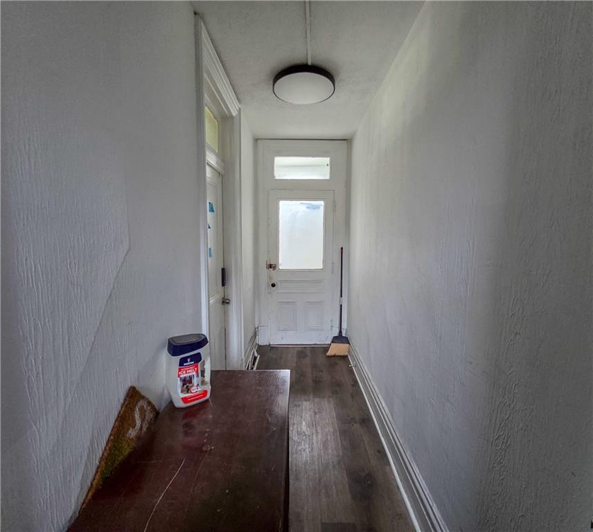 1809 Rialto Street Pittsburgh, PA 15212 - Photo 12 of 36 a view of a hallway with wooden floor and staircase
