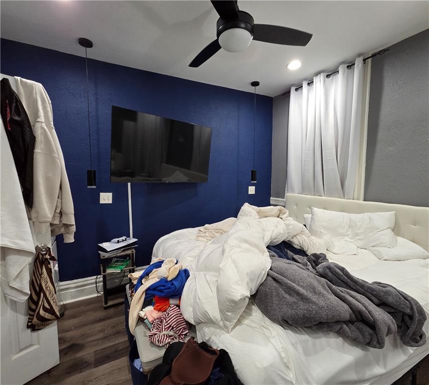 1809 Rialto Street Pittsburgh, PA 15212 - Photo 20 of 36 a bedroom with a bed and a flat tv screen on dresser
