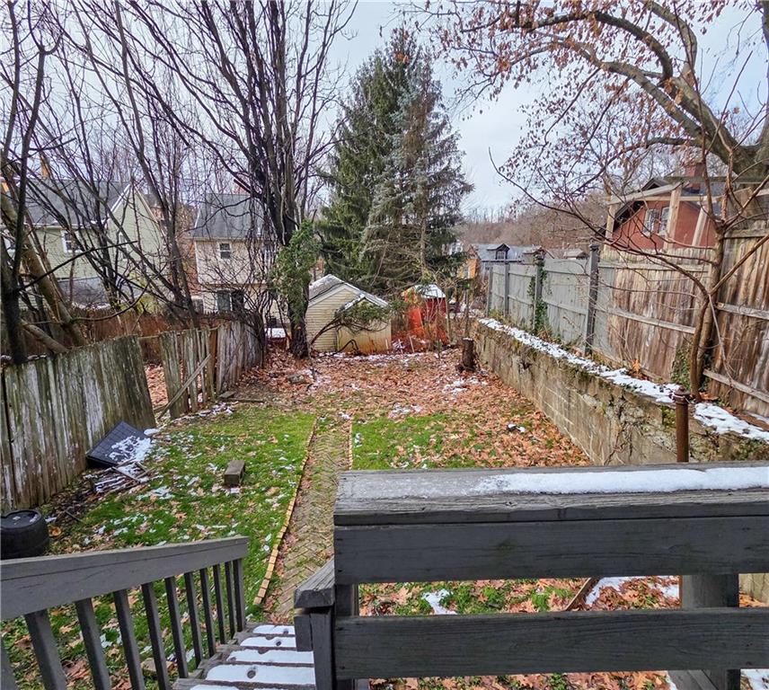 1809 Rialto Street Pittsburgh, PA 15212 - Photo 9 of 36 a view of a yard with a wooden fence