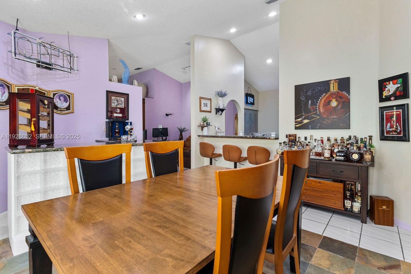 9871 Southwest 58th Court Cooper City, FL 33328 - Photo 21 of 54 a living room with furniture kitchen view and a large window