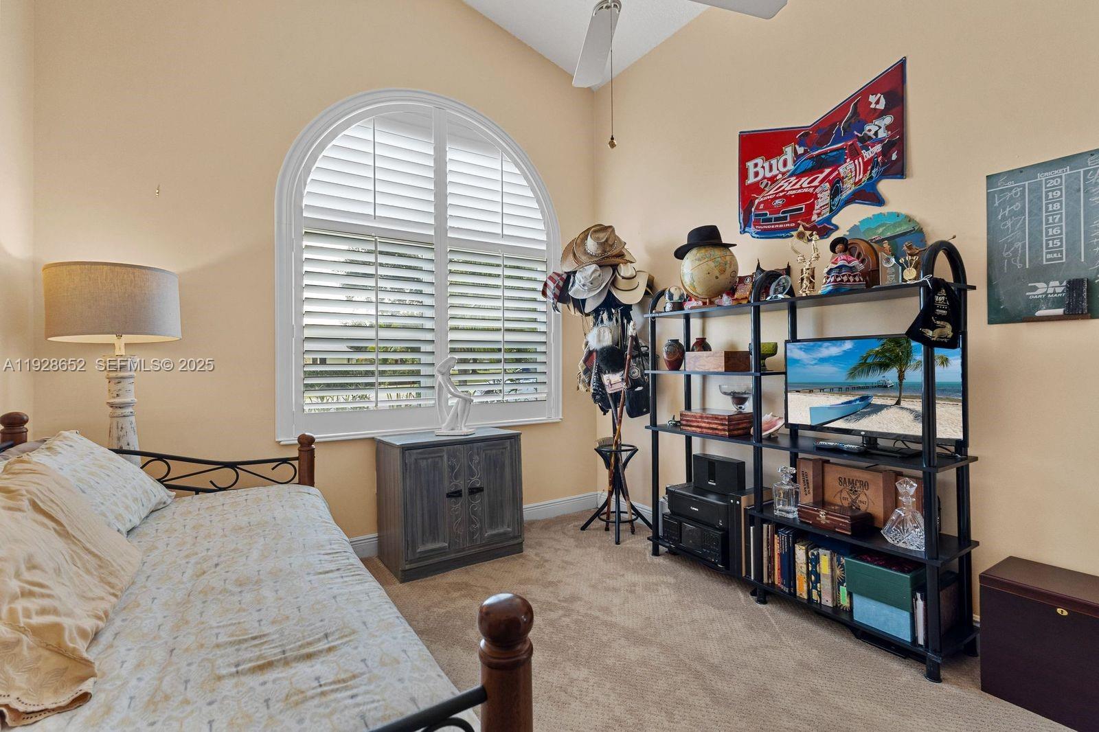 9871 Southwest 58th Court Cooper City, FL 33328 - Photo 26 of 54 a bedroom with furniture and a window