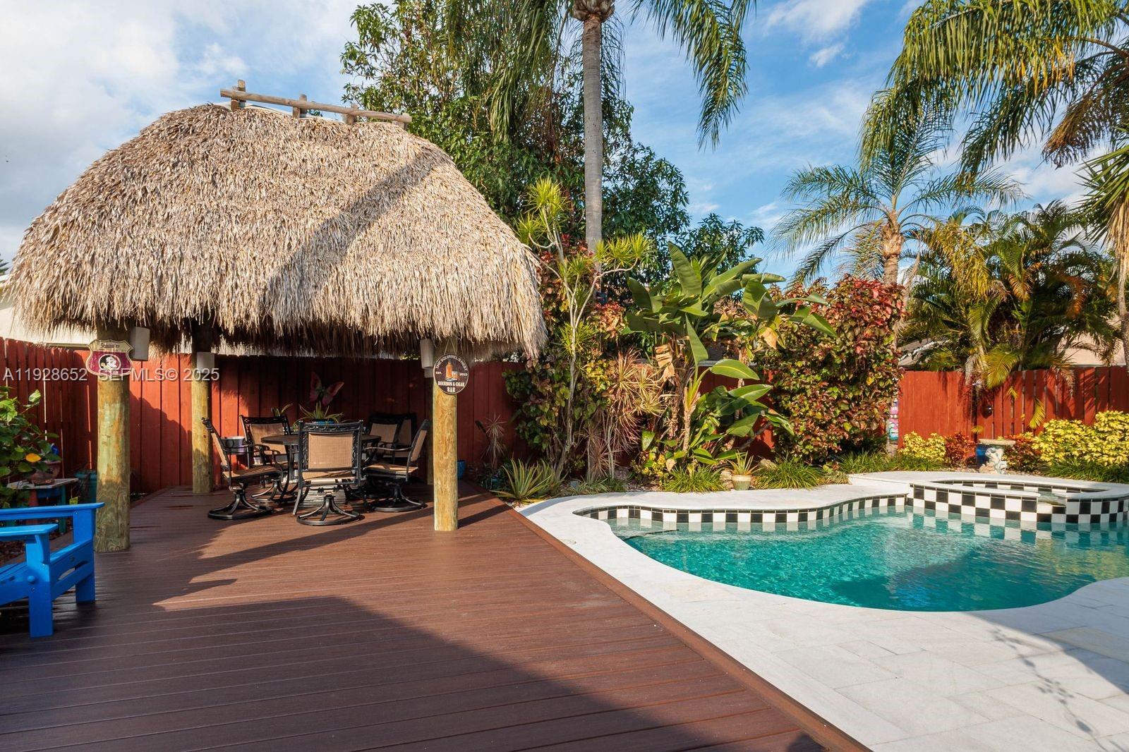 9871 Southwest 58th Court Cooper City, FL 33328 - Photo 3 of 54 a view of a park with plants and trees