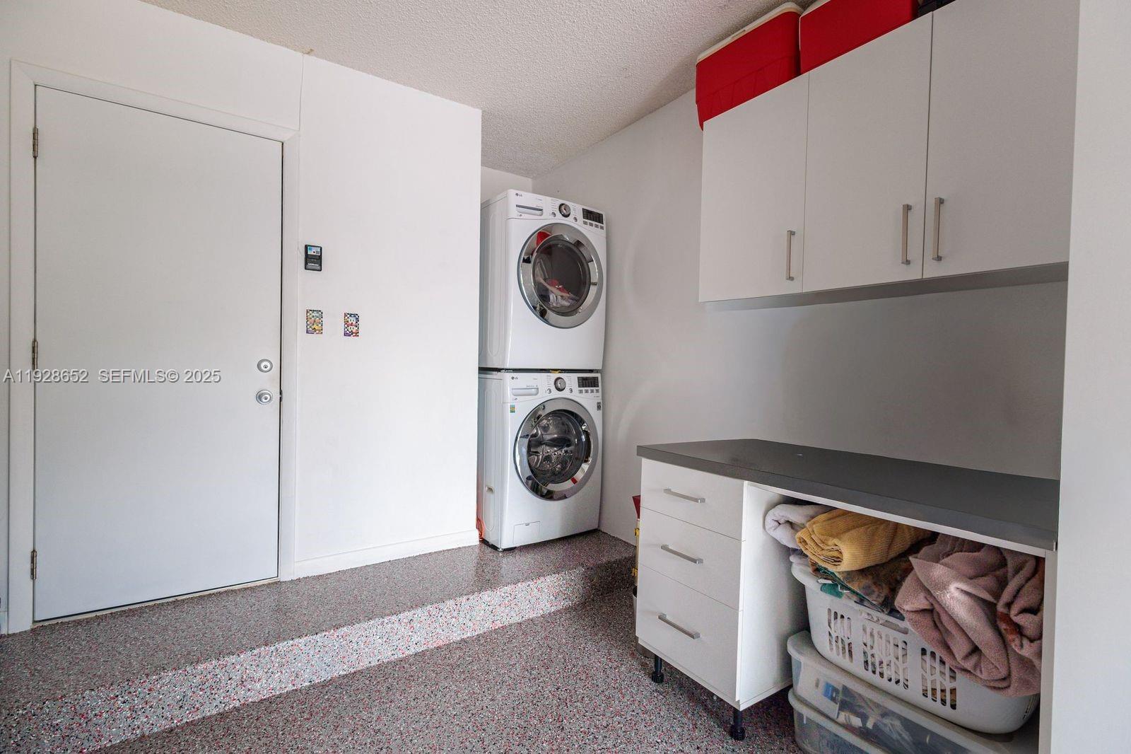 9871 Southwest 58th Court Cooper City, FL 33328 - Photo 34 of 54 a utility room with dryer and washer