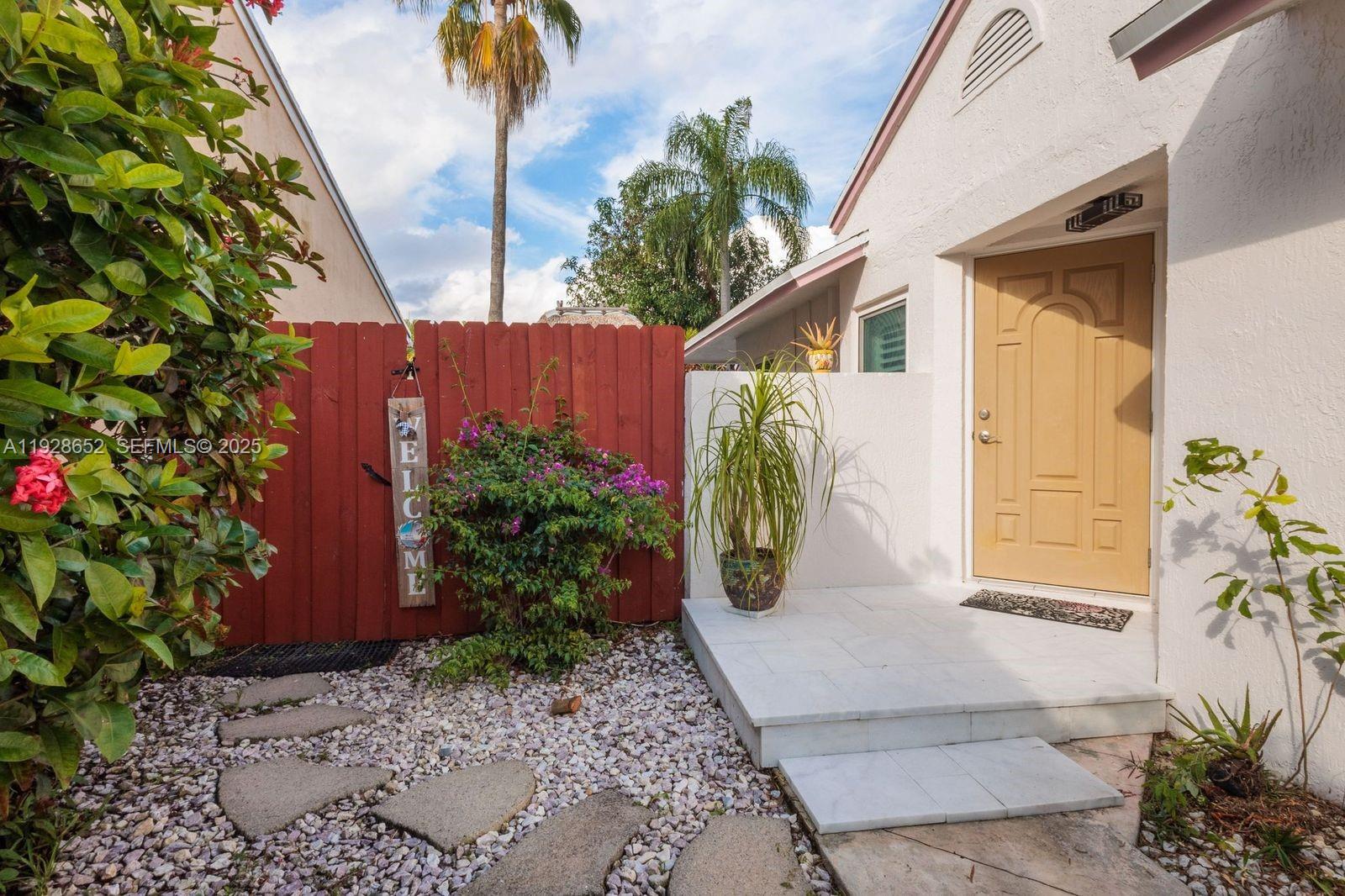 9871 Southwest 58th Court Cooper City, FL 33328 - Photo 36 of 54 a view of a house with potted plants