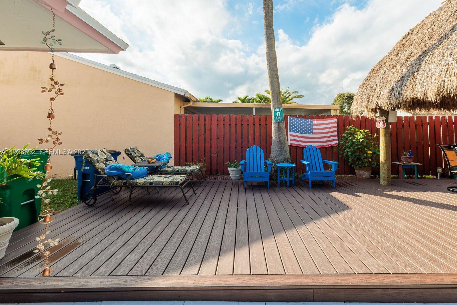 9871 Southwest 58th Court Cooper City, FL 33328 - Photo 37 of 54 a view of a wooden deck with furniture