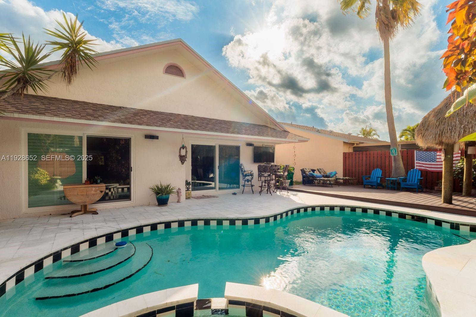 9871 Southwest 58th Court Cooper City, FL 33328 - Photo 41 of 54 a view of a house with pool porch and sitting area