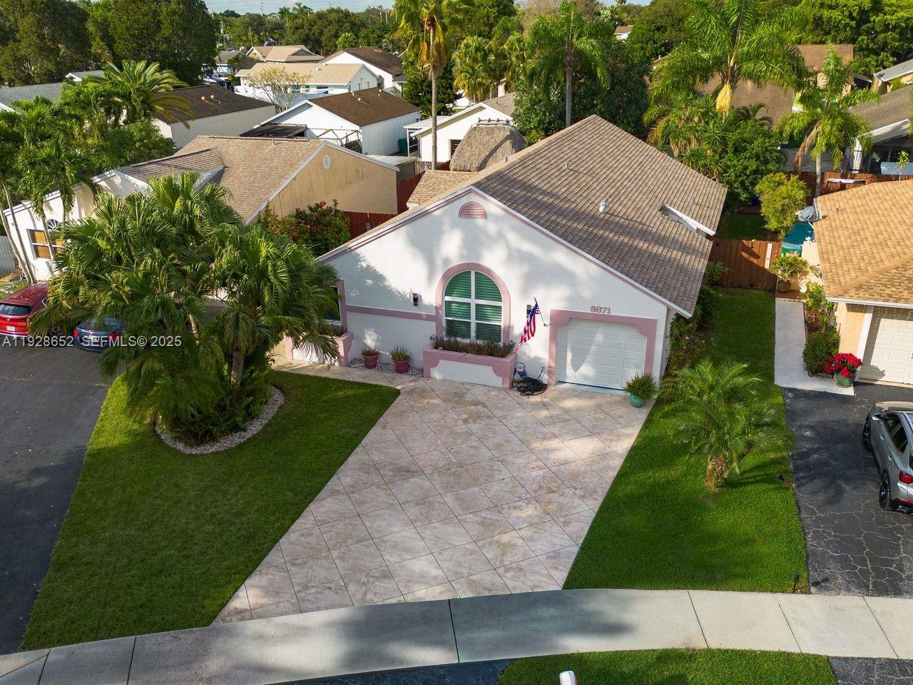 9871 Southwest 58th Court Cooper City, FL 33328 - Photo 45 of 54 a view of house with garden