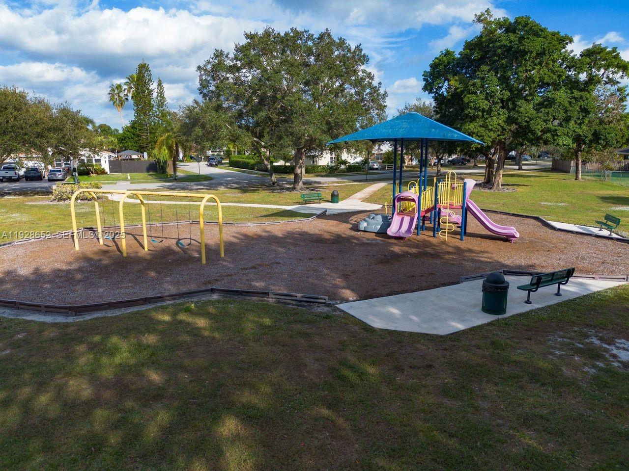 9871 Southwest 58th Court Cooper City, FL 33328 - Photo 47 of 54 a view of a swimming pool with a patio